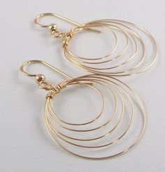 Goldfilled wire used to make this earring.  Earring length is 1 3/4 inches. Largest hoop diameter is 1 inch.  Also available in sterling silver and clip on style. Modern Wire Wrapped Hoop Earrings, Minimalist Wire Wrapped Round Hoop Earrings, Minimalist Wire Wrapped Hoop Earrings, Everyday Small Hoop Earrings Wire Wrapped, Everyday Wire Wrapped Hoop Earrings, Modern Wire Wrapped Hoop Jewelry, Wire Wrapped Hoop Jewelry, Modern Wire Wrapped Round Hoop Earrings, Modern Wire-wrapped Round Hoop Earrings