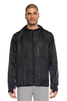 Made from lightweight polyester, this jacket is designed to keep you protected from the elements while being easy to pack away. The left side of the jacket features a zipper and contrast color while the right side is a printed reflective silver for added visibility in low light conditions. The jacket also comes with a left side zipper and a center front zipper. With its adjustable hood and elasticized cuffs, this jacket is both functional and stylish. Product Features: Lightweight Wind-resistant Left side zipper Center front zipper 2 side pockets Model Is Wearing Size M: Height - 1m80 - 5'11 Waist - 31 Outdoor Nylon Windbreaker With Zipper Closure, Nylon Windbreaker With Zipper For Outdoor Activities, Black Nylon Track Jacket For Outdoor, Athleisure Windbreaker With Zipper Closure For Outdoor, Athleisure Windbreaker With Zipper For Outdoor, Athleisure Windbreaker For Outdoor, Nylon Hooded Track Jacket With Reflective Details, Outdoor Nylon Track Jacket With Zipper, Hooded Nylon Windbreaker With Reflective Details