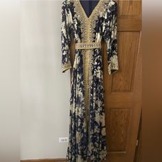 Kuftan Dress Dubai/Morrocan. Worn Once, Like New! Navy Blue/Indigo And Gold Kaftan. Made In Dubai. Comes With A Belt And Zips From The Back. Size Xl. Very Beautiful, And Flowy! Measurements: Length From Shoulder To Sleeves 22 Inches Chest: 19 Inches In Front; Back Also 19 Inches. 38 Inches All Round Chest And Back. Bollywood Style Blue Floral Print Dress, Blue Bollywood Dress With Floral Print, Bollywood Blue Floral Print Dress, Bohemian Kaftan For Evening And Eid, Bohemian Evening Dresses For Eid, Bollywood Style Blue V-neck Dress, Bollywood Blue V-neck Dress, Blue Bollywood V-neck Dresses, Bohemian Floral Print Evening Kaftan