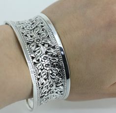 Vintage Highly Detailed Handmade Scroll Floral Wide Design Cuff Bracelet 925 Sterling Silver BR 260 Condition: Vintage Metal:  925 Sterling Silver Weight: 25.8 grams Bracelet Size: 6.75 in Width : 25.46mm Images you see are actual pictures of jewelry you will receive Every purchase comes thoughtfully packaged and ships within 1 business day New York State buyer will be charged sales tax Feel free to contact us with any questions. We are open Mon-Fri 9-5 EST We appreciate your business Silver Engraved Vintage Bracelet, Vintage Adjustable Etched Sterling Silver Bracelet, Vintage Silver Etched Cuff Bracelet, Vintage Etched Metal Cuff Bracelet, Vintage Silver Hand-tooled Cuff Bracelet, Silver Gifts, Bracelet Sizes, Vintage Metal, New Day