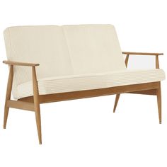 a white couch sitting on top of a wooden frame