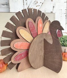 a wooden turkey sitting on top of a table