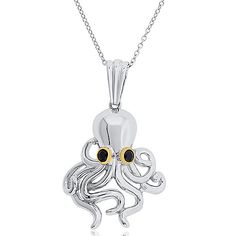 an octopus pendant with two yellow eyes