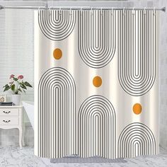 a bathroom with a shower curtain that has circles on it