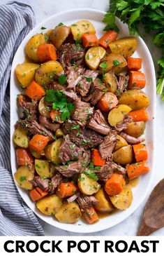 a white plate topped with meat and veggies on top of a marble counter