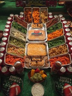 a football themed buffet with many different foods