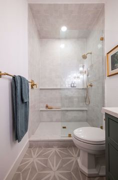 a bathroom with a toilet, shower and bathtub in it's center area