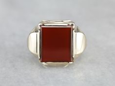 Simple and solid in size, this could be a great vintage piece! Dating to the mid-1900's, and the popular style continues to be a favorite decades later. The center of this ring is set with a deep, brick-red carnelian. Carnelian is traditionally a stone of courage, worn by leaders and heroes. Metal: 10K Yellow Gold Gem: Carnelian Gem Measurements: 11.3 x 14 mm, Rectangle Ring Size: 7.75 Marks: "HANDWROUGHT 10K" Stamped on the inside band Mens Vintage Jewelry, Yellow Gold Sapphire Ring, Rectangle Ring, Retro Era, Red Carnelian, Carnelian Ring, Cameo Ring, July Birthstone, Brick Red