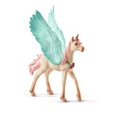 a small toy horse with wings on it's head and tail, standing in front of a white background