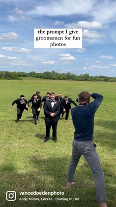 a group of men standing on top of a grass covered field next to each other