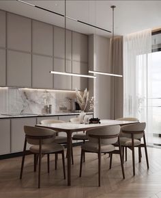 a dining room table and chairs in front of an open kitchen with marble counter tops