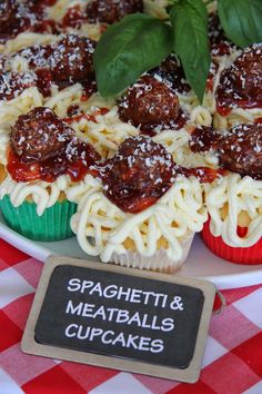 spaghetti and meatballs cupcakes on a plate with a sign that says spaghetti & meatballs cupcakes