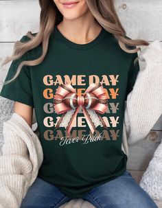 Game Day Football Shirt. Get ready for kickoff with this "Game Day" t-shirt, perfect for football fans, football games, or casual outings.  This shirt is a must-have for any true football enthusiast. Wear it proudly and let everyone know that it's game day. This classic unisex jersey short sleeve tee fits like a well-loved favorite. Soft cotton and quality print make users fall in love with it over and over again. These t-shirts have-ribbed knit collars to bolster shaping. The shoulders are tapered for a better fit over time. Dual side seams hold the garment's shape for longer. .: Made with 100% Airlume combed and ring-spun cotton, a lightweight fabric (4.2 oz/yd² (142 g/m that is easy to layer, breathable. Perfect for active and leisure wear.  .: Bella+Canvas manufactures all its products Green T-shirt With Sublimation Print For Football Season, Green T-shirt With Letter Print For Football Season, Green T-shirt With Team Name For Game Day, Green Fan Apparel T-shirt For Game Day, Green T-shirt For Game Day, Green Football Season Sports Fan T-shirt, Green Sports Fan T-shirt For Football Season, Green Pre-shrunk T-shirt For Football Season, Pre-shrunk Green T-shirt For Football Season