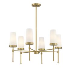 a brass chandelier with white shades