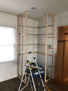 a ladder is in the corner of a room