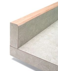 a close up of a wooden and concrete bench