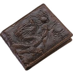 a brown leather wallet with dragon design on it