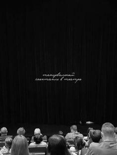 people sitting in front of a black stage with the words, management and management written on it