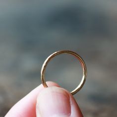 Entirely hand-forged and handmade from solid 14k gold, this is a lovely and simple ring perfect for everyday wear. At 1.6mm wide and 1.5mm thick, it is more substantial than my slim hammered bands. I can make this ring in either 14k yellow or 14k rose gold (the photos show yellow gold). The top is lightly hammered to create shimmering details, while the sides and interior remain smooth. This ring has a timeless elegance that will last for generations, perfect for a woman's wedding band. This is Textured Gold Ring, Tree Bark Texture, Ring Tree, Bark Texture, 14k Gold Wedding Ring, Hammered Ring, Hammered Band, Hammered Rings, Simple Ring