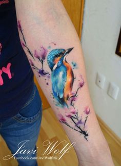 a woman with a colorful tattoo on her arm