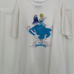 This Shirt Was Never Worn White Disney Crew Neck T-shirt, Disney White Pre-shrunk T-shirt, White Pre-shrunk Disney T-shirt, White Short Sleeve Disney T-shirt, White Cotton Disney Shirt, White Disney Crew Neck Shirt, Disney White Tops With Character Print, Disney Graphic Print White Tops, White Disney Graphic Print Tops