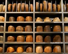 many pots and pans on shelves in a room