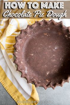 a chocolate pie sitting on top of a yellow and white napkin