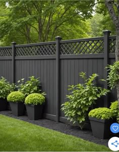 an image of a fence with potted plants