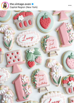 decorated cookies are displayed on a white surface