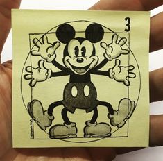 a drawing of mickey mouse on a piece of paper with the number 3 in it