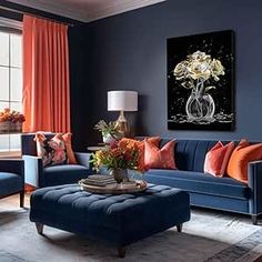 a living room with blue couches and orange pillows