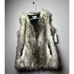 Condition: New With Tags Size: Medium Color: Multicolor Product Details: Faux Fur Sleeveless Polyester Lining Dry Clean Imported Chic Sleeveless Outerwear With Faux Fur Trim, Fall Sleeveless Outerwear With Faux Fur Trim, Sleeveless Outerwear With Faux Fur Trim For Fall, Sleeveless Fall Outerwear With Faux Fur Lining, Sleeveless Outerwear With Faux Fur Lining For Fall, Chic Faux Fur Vest For Fall, Vest Womens, Faux Fur Vest, Faux Fur Vests