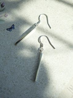 Dainty dangle earrings High polished sterling silver Perfect Earrings for Everyday Wear Size:Small, 1 5/8" total height Hook. Bar Measure 7/8" Long x 1/8" Wide 925S Stamp on Hook 925 Sterling Silver Bar Dangle Earrings. Skinny silver Bars. About 1.80 CM with out hook. Hook Closure with 925 mark stamp. Made of 925 Sterling Silver. Hypoallergenic Trendy Sterling Silver Earrings. Dainty, Light Weight Dangling Earring Classic Sterling Silver Dangle Earrings, Silver Dangle Linear Earrings As Gift, Silver Dangle Linear Earrings For Gift, Sterling Silver Long Drop Earrings As Gift, Silver Long Drop Classic Earrings, Classic Long Drop Earrings As Gift, Silver Hallmarked Minimalist Earrings, Classic Silver Long Drop Earrings, Classic Long Drop Earrings For Gifts