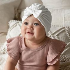 These baby turban hats are a perfect hospital hat for newborns as part of a coming home outfit. They are also a great unique baby gift for baby showers. Made from super soft cotton knit fabric. They have a comfortable stretch of about 1.5 inches. NEW neutral colored turban hats here >> https://etsy.me/3gyIcuEYou might also like our best selling headband here! >> https://etsy.me/3vdayyW>>SIZINGNewborn: 14"0-3 months: 15"3-12 months: 16.5"12-18 months: 17.5"18 months- 4T: 18.5"5T Baby Bow Hats, Baby Turban Hat, Infant Hat, Baby Winter Hats, Baby Turban, Toddler Headbands, Unique Baby Gifts, Baby Bow, Turban Hat