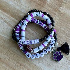 two bracelets with beads and charms that spell out the word amen