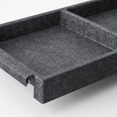 a gray tray with two compartments on the bottom and one in the middle for storage