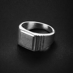 316L Stainless steel  Water, sweat & heat proof  Hypoallergenic (No green skin) Modern Out's Newmark Ring is forged in premium 316L Stainless steel. This signet style men's ring is the perfect classic look with a slight edge. Wear alone or stack with other bands or rings on any other finger. This ring is waterproof, tarnish-proof, and hypoallergenic - no green fingers. US Sizes 9, 10, 11, 12 12.5mm thick Made of stainless steel ► International orders are subject to tax/duty fees. This is uncontr Classic Durable Silver Jewelry, Durable Silver Promise Ring, Luxury Modern Stainless Steel Men's Ring, Black Stainless Steel Rings For Streetwear, Rectangular Silver Stainless Steel Signet Ring, Luxury Modernist Men's Silver Ring, Brutalist Sterling Silver Signet Ring Gift, Slight Edge, Silver Brutalist Hand-cast Rings