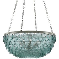 a glass chandelier hanging from a chain