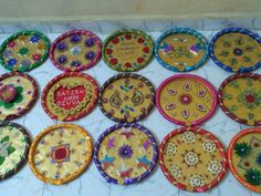 there are many decorative plates on the table