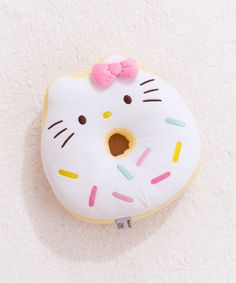 a white hello kitty donut with sprinkles on it