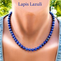 Add a touch of elegance to your ensemble with this exquisite Lapis Lazuli Necklace. Featuring beautiful 8mm Lapis Lazuli beads in varying shades of blue, this stunning necklace exudes timeless beauty and sophistication. Each bead is meticulously strung on durable steel wire and finished with a secure clasp, ensuring both style and durability. Elevate your look with this captivating blue gemstone jewelry that is perfect for any occasion. Necklace length 18 Inches + 2 in Extender Difference in col Elegant Lapis Lazuli Crystal Necklace With Gemstone Beads, Elegant Blue Necklaces With 8mm Beads, Elegant Blue Necklace With 8mm Beads, Elegant Blue Gemstone Bead Crystal Necklace, Elegant Blue Crystal Necklaces With Gemstone Beads, Elegant Blue Crystal Necklaces With Round Beads, Elegant Sapphire Crystal Necklaces With Round Beads, Elegant Sapphire Round Beads Crystal Necklace, Elegant Blue Crystal Necklace With Round Beads