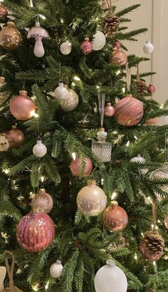 a christmas tree with ornaments hanging from it