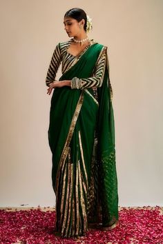 Dark green saree with striped pattern gota work and soft organza pallu. Comes with coordinating gota work blouse. - Aza Fashions Green Fitted Saree For Festive Season, Fitted Green Saree For Festive Occasions, Green Saree For Reception And Navratri, Designer Green Anarkali Pre-draped Saree, Green Anarkali Designer Pre-draped Saree, Anarkali Designer Pre-draped Green Saree, Anarkali Green Pre-draped Saree For Designer Wear, Green Festive Blouse Piece For Navratri, Green Blouse Piece For Eid Reception