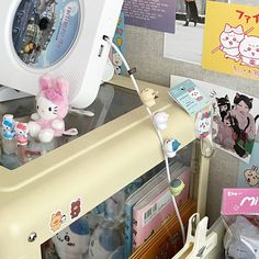 there are many items on the shelf in this room, including an alarm clock and toys