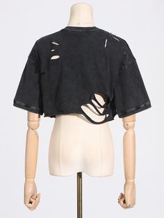 Tune into your rebellious side when you wear The DISTRESSED STUDDED SHORT SLEEVE T SHIRT ! Crafted from a semi-stretchy cotton base fabrication, this grunge-inspired top features a mineral wash finish, a mock neckline, short sleeves, a cropped silhouette with a raw hemline, and an easy pull-on fit. Complete with ultra-distressed ripped accents, cut out detailing, silver metallic pointed studs, and safety pin embellishments, successfully delivering that sought-after alternative flare. Style with a bralette, relaxed fit denim, and platform sneakers to finish off your look.Size Chart（CM）: Edgy Cotton Cropped T-shirt With Crew Neck, Edgy Washed Black T-shirt For Spring, Grunge Cotton Cropped T-shirt For Streetwear, Urban Style Washed Black Summer Tops, Punk Crew Neck Tops For Summer, Punk Crew Neck Summer Tops, Ripped Short Sleeve T-shirt For Summer, Punk Style Stretch Cropped Tops, Punk Style Cropped Stretch Tops