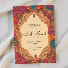 an ornate wedding card with the words, you are invited to the ceremony of all and alright