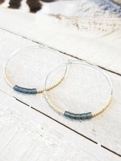 Champagne and matte Montana Blue cube seed beads. 1 ³/⁴ inches in diameter. Nickel free hoops. Choose gold or silver hoops. Return to shop 👇 https://www.etsy.com/shop/AxeandSparrow PLEASE MAKE SURE YOUR ADDRESS IS ENTERED CORRECTLY. IF YOU ARE DOING A GUEST CHECKOUT PLEASE PLEASE DOUBLE CHECK YOUR ADDRESS AND YOUR EMAIL. THANK YOU! *All feathers are cruelty free. All hooks are lead and nickel free. All leather is genuine leather. *Please feel free to contact me with ANY questions or custom crea Nickel Free Bohemian Beaded Earrings, Nickel Free Bohemian Beaded Earrings For Everyday, Nickel-free Bohemian Beaded Earrings, Bohemian Nickel Free Beaded Earrings For Everyday, Everyday Bohemian Nickel-free Beaded Earrings, Bohemian Beaded Hoop Earrings For Everyday, Everyday Bohemian Beaded Hoop Earrings, Bohemian Adjustable Hoop Earrings With Spacer Beads, Adjustable Bohemian Hoop Earrings With Spacer Beads