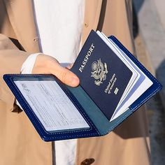 a person holding a passport in their hand