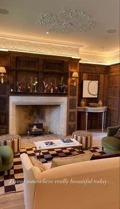 a living room filled with furniture and a fire place in the middle of a room