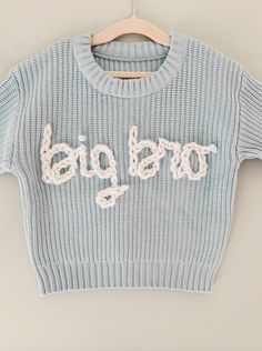 The perfect big brother gift! Sample shown is a sweater in ice blue with white embroidery, all lowercase only. *If you're looking for a specific sweater or yarn color, please send me a message and I can source it for you. TO ORDER -Select size and sweater color via the drop down menus -In the personalization box, leave embroidery color SIZING AND FIT -All sweaters are an OVERSIZED fit, perfect for watching baby grow throughout their first year, layering, or having a long lasting, heirloom piece. Big Brother Announcement, Big Brother Gift, Big Brother Shirt, Brother Shirts, Embroidered Sweater, Gender Neutral Baby Clothes, White Embroidery, Baby Grows, Big Brother